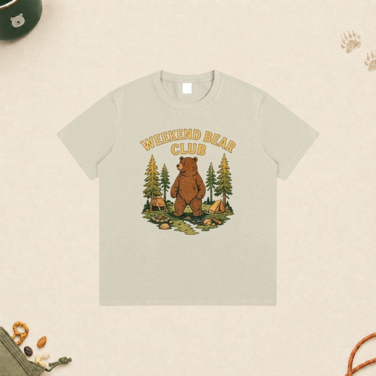 WEEKEND BEAR CLUB | WEEKDAY HUMAN. WEEKEND BEAR. beige cotton t-shirt with a bear camping graphic print