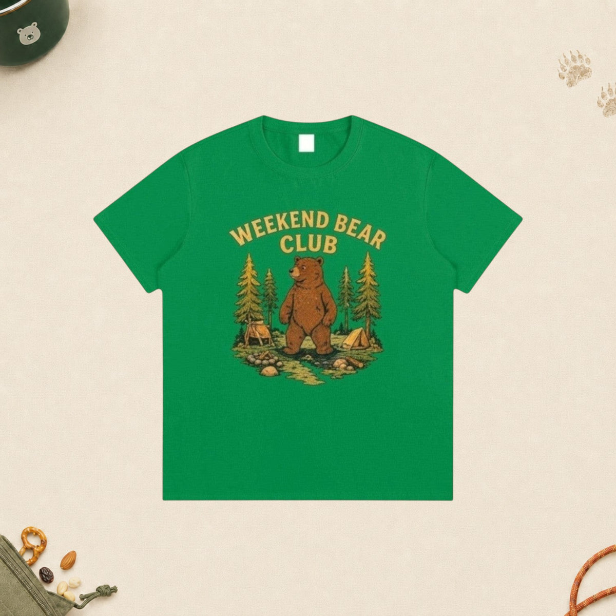 WEEKEND BEAR CLUB | WEEKDAY HUMAN. WEEKEND BEAR. green cotton t-shirt with a bear camping graphic print